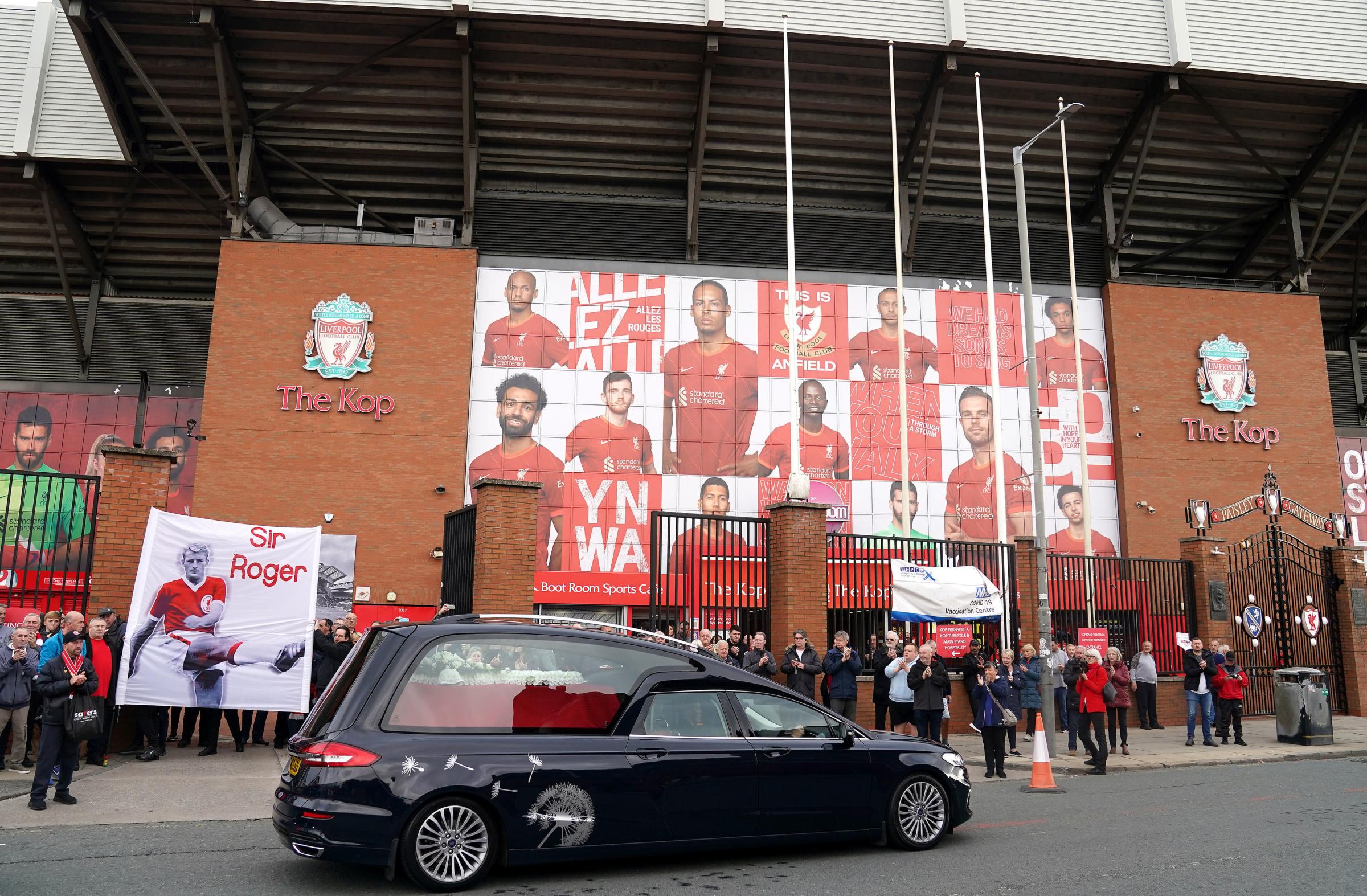 Fans gather outside Anfield to bid a final farewell to Roger Hunt. Pictures by Mike Egerton/PA Wire