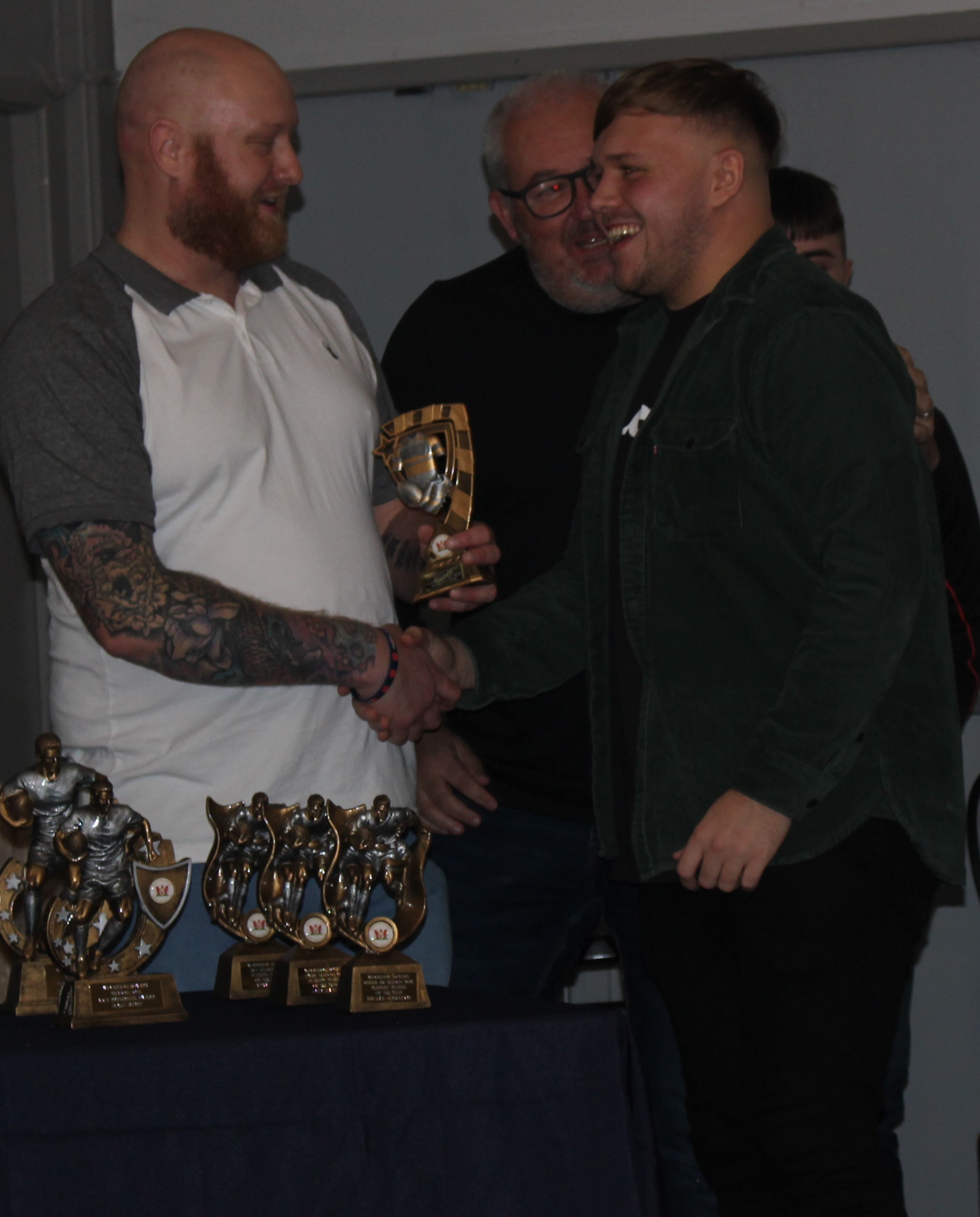 Nathan Evans, right, receives the Clubman of the Year prize