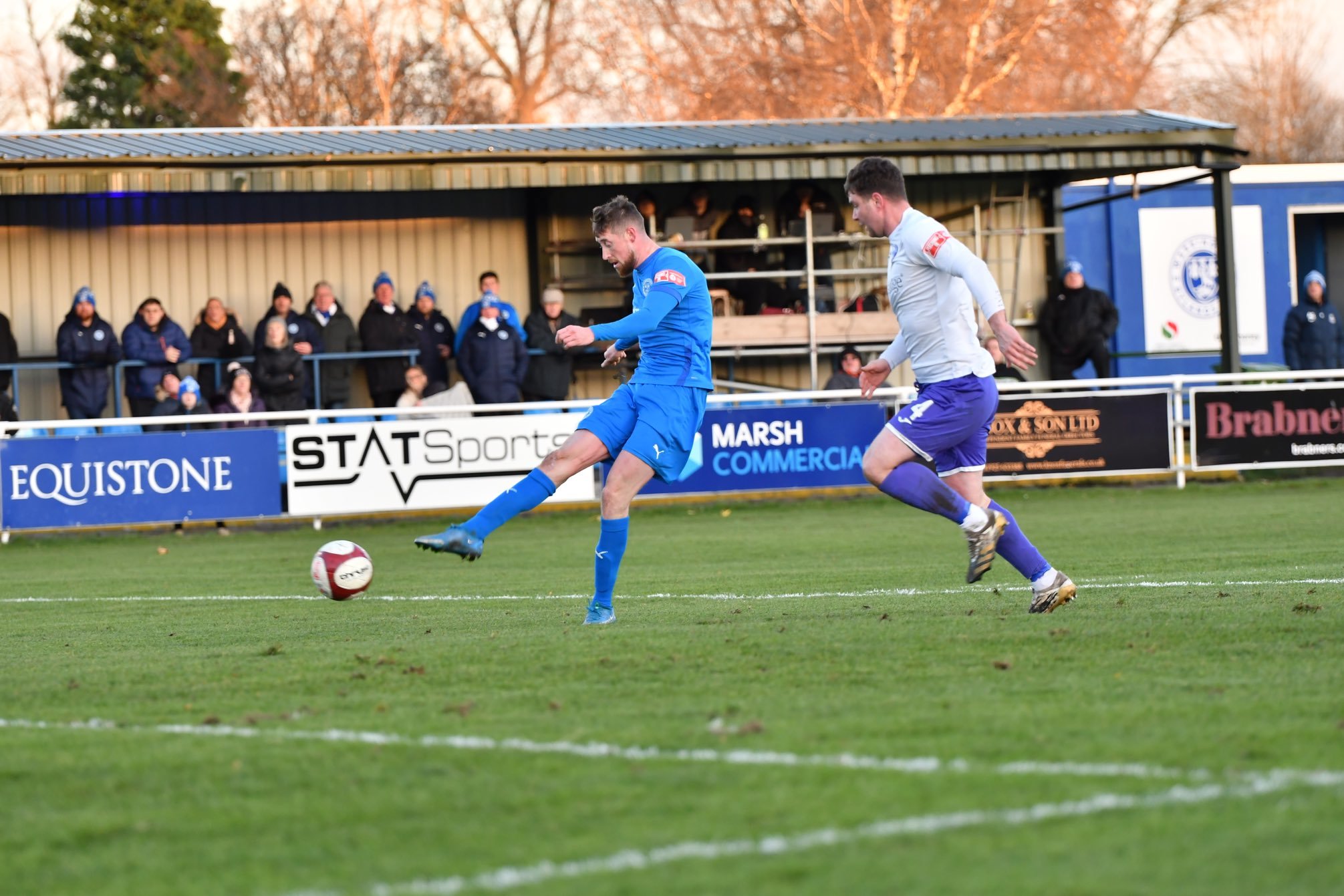 Joe Bunney scores against Ramsbottom United. Picture by Mark Percy