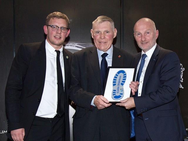 Colin Stanton, centre, receiving his Heart and Soul Award from Warrington Wolves Charitable Foundation director Neil Kelly, left, and Warrington's England cricket legend Neil Fairbother
