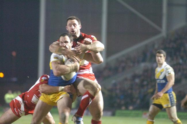 Adrian Morley is roughed up by the Wigan defence in the Super League round three derby in 2010. Picture: Mike Boden