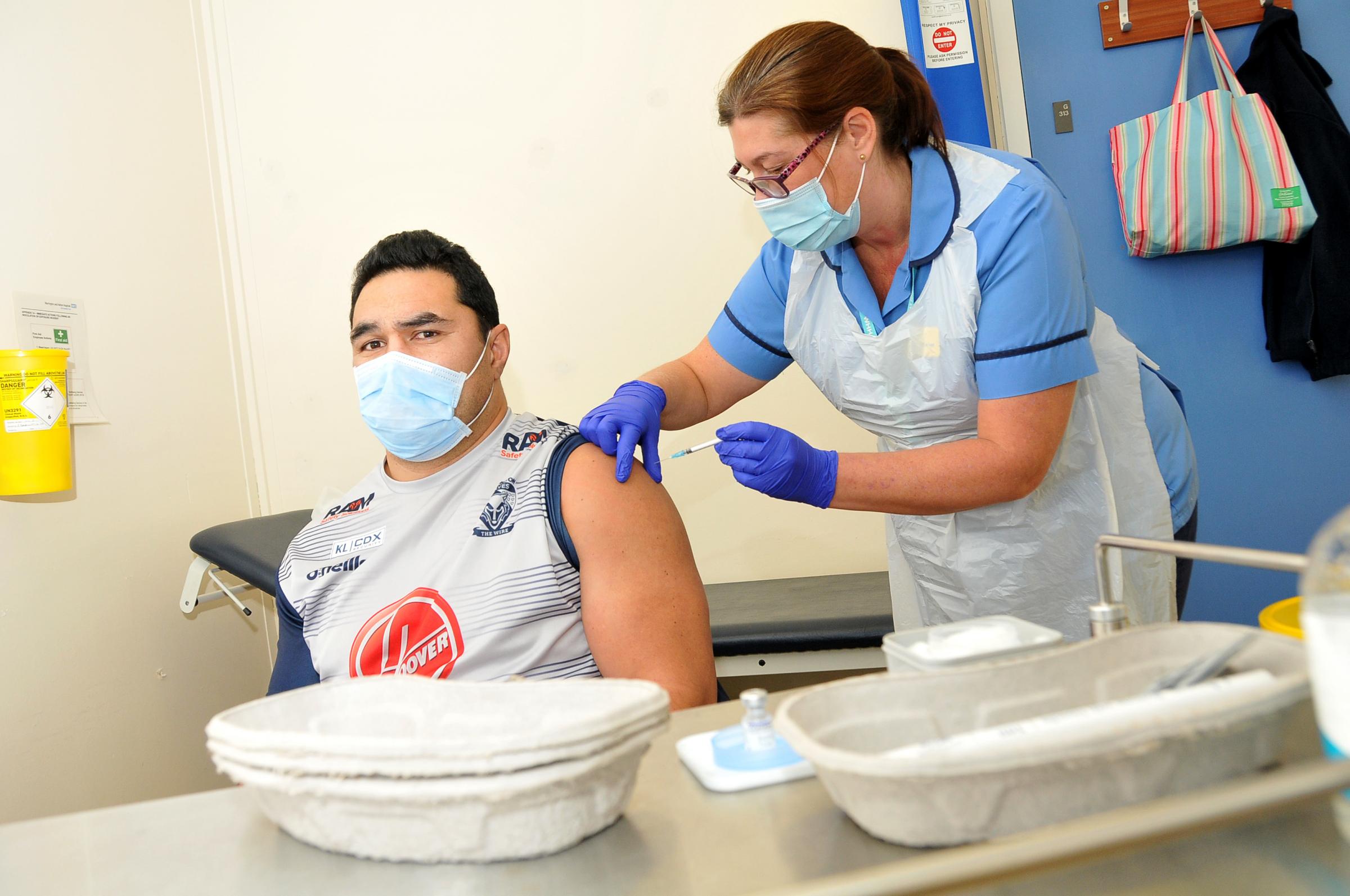Kylie Leuluai receives his Covid booster vaccine at Warrington Hospital (Image: Dave Gillespie)