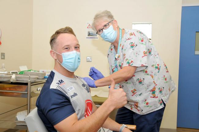 Jason Clark receives his Covid booster vaccine at Warrington Hospital (Image: Dave Gillespie)