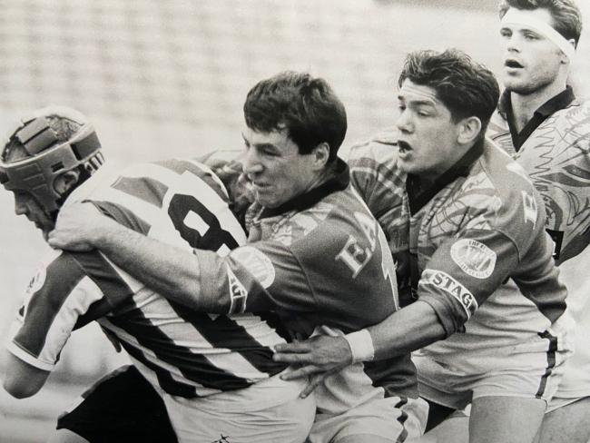 Daryl Powell, second from right, helping a Sheffield Eagles teammate get to grips with Warrington Wolves prop Gary Chambers in the mid 1990s