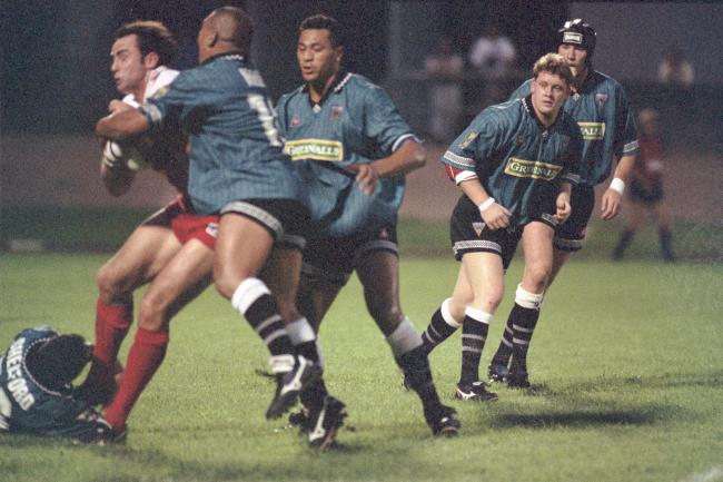Who is the upright Warrington Wolves player making this tackle against Paris St Germain in 1997? Picture: Mike Boden