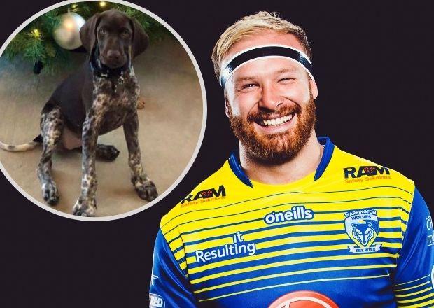 Oliver Holmes and his new puppy dog Poppy. Pictures: Warrington Wolves/Instagram