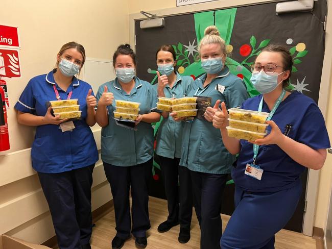 Staff at Warrington Hospital receive hot meals from The Cottage and Cardamon Lounge