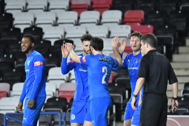 Declan Walker is congratulated after scoring his last-gasp winner at Widnes. Picture by Mark Percy