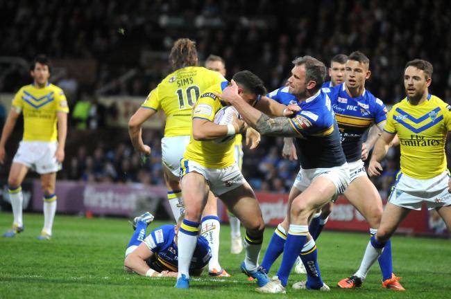 Who is the Warrington Wolves player carrying the ball? Picture: Mike Boden