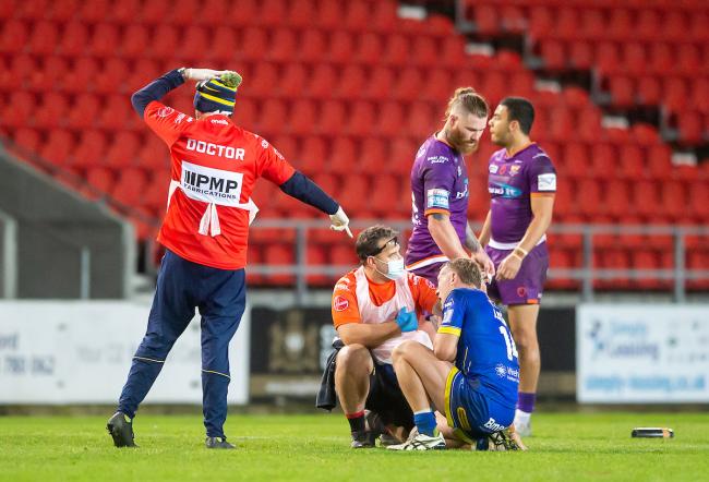 Jason Clark undergoes an on-field concussion assessment against Huddersfield in 2020. Picture by SWPix.com