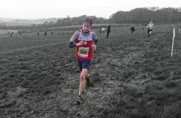 Warrington Guardian: Jack Marwood on his way to bronze for Warrington Athletics Club in the 2022 Cheshire Cross Country Championships under 15s race