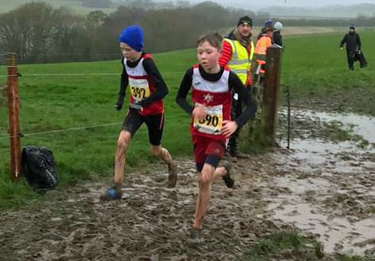 Warrington Guardian: Ben Woods, left, and Archie Marwood battling with the tricky terrain