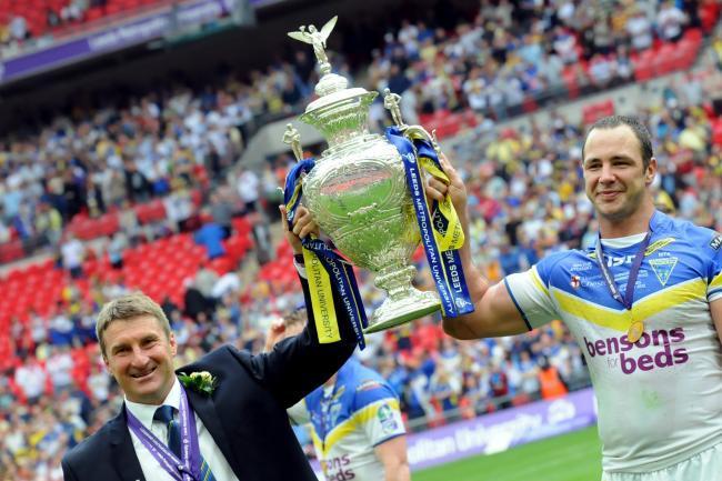 Adrian Morley holds aloft the Challenge Cup alongside then-Wire boss Tony Smith back in 2012. Picture by Mike Boden