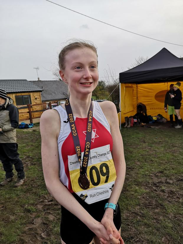 Warrington Guardian: Ellen Turnbull with her bronze medal for Warrington Athletics Club in the 2022 Cheshire Cross Country Championships