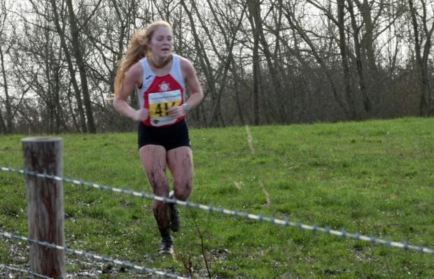 Warrington Guardian: Rachel McQuillan pounding through the fields in the 2022 Cheshire Cross Country Championships senior women's race
