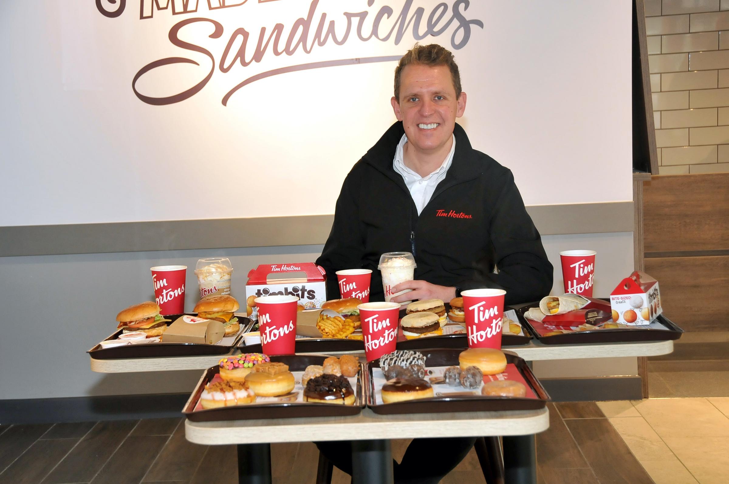 Chief marketing executive Kevin Hydes pictured with some of the food options