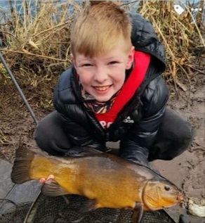 Nine-year-old Cameron Daly with his catch