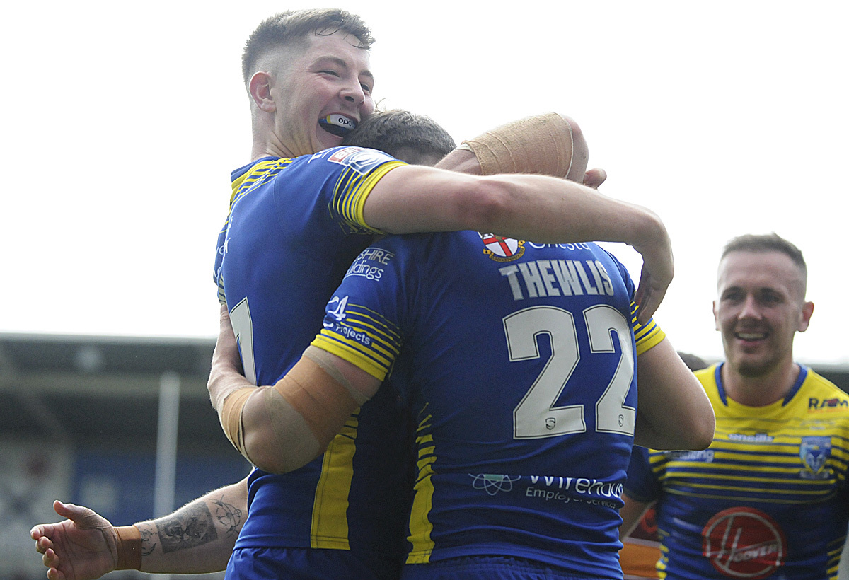 Riley Dean congratulates Josh Thewlis on one of his three tries against Huddersfield Giants. Picture by Mike Boden