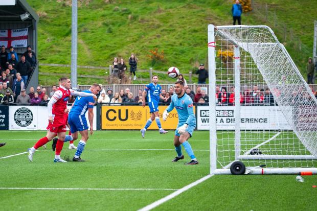 Josh Amis heads home Warrington Town's equaliser against Scarborough Athletic, but Town eventually lost the game 2-1. Picture by Karl Vallantine