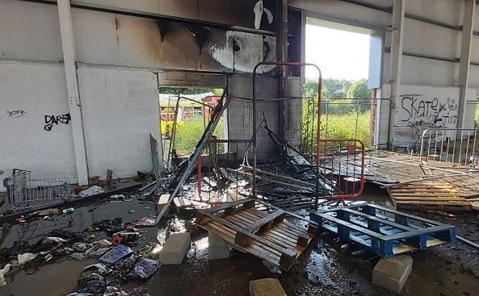 Wooden pallets were set alight by arsonists in the empty units