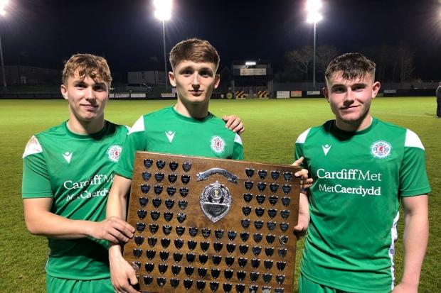 Michael Holden, centre, with two of his Wales Schoolboys under 18s teammates as they celebrate winning the Centenary Shield