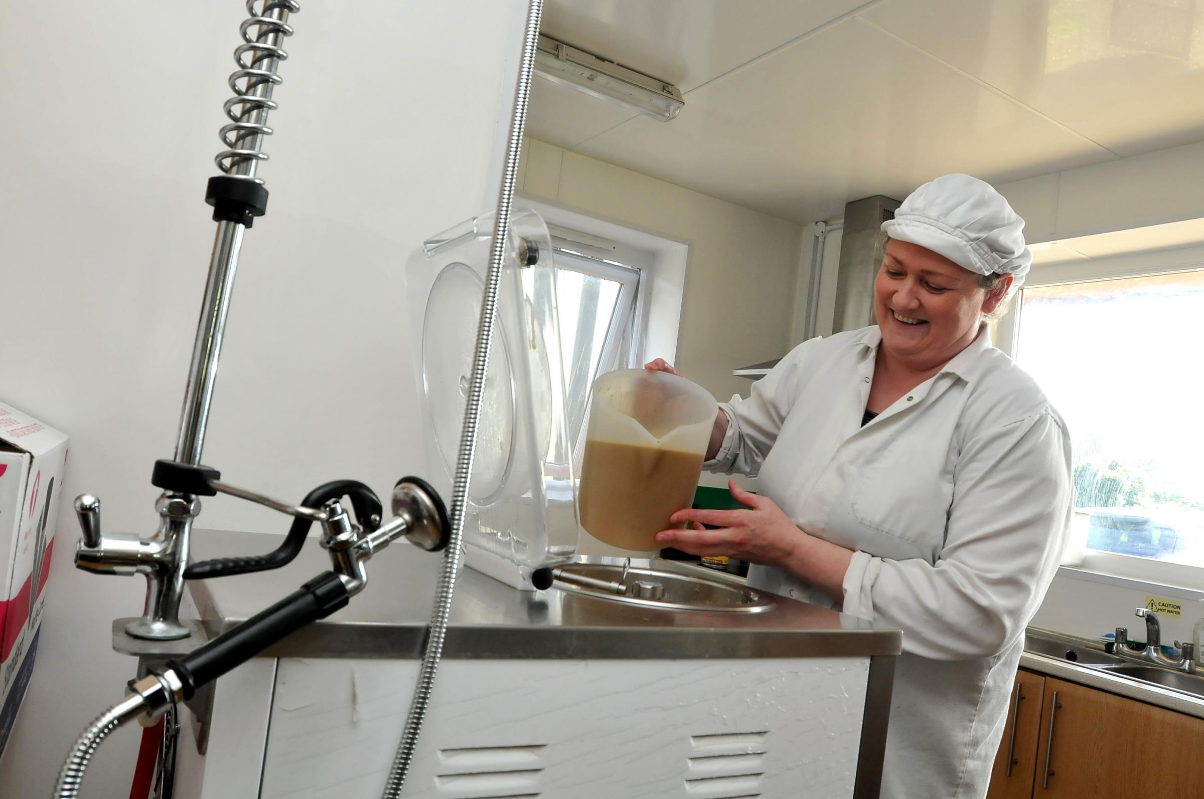 Emma Whitlow helps to make the ice cream on site
