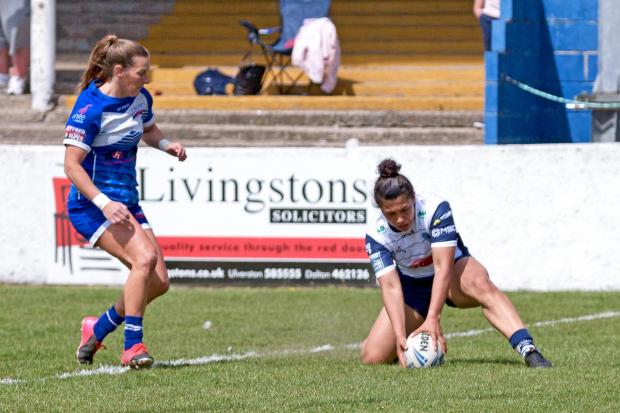 Georgia Sutherland touches down for one of her two tries against Barrow. Picture by Bob Brough