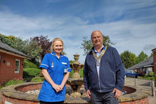 Outgoing Northwich Rotary Club president Rupert Adams with St Luke's staff nurse Nicola Thompson