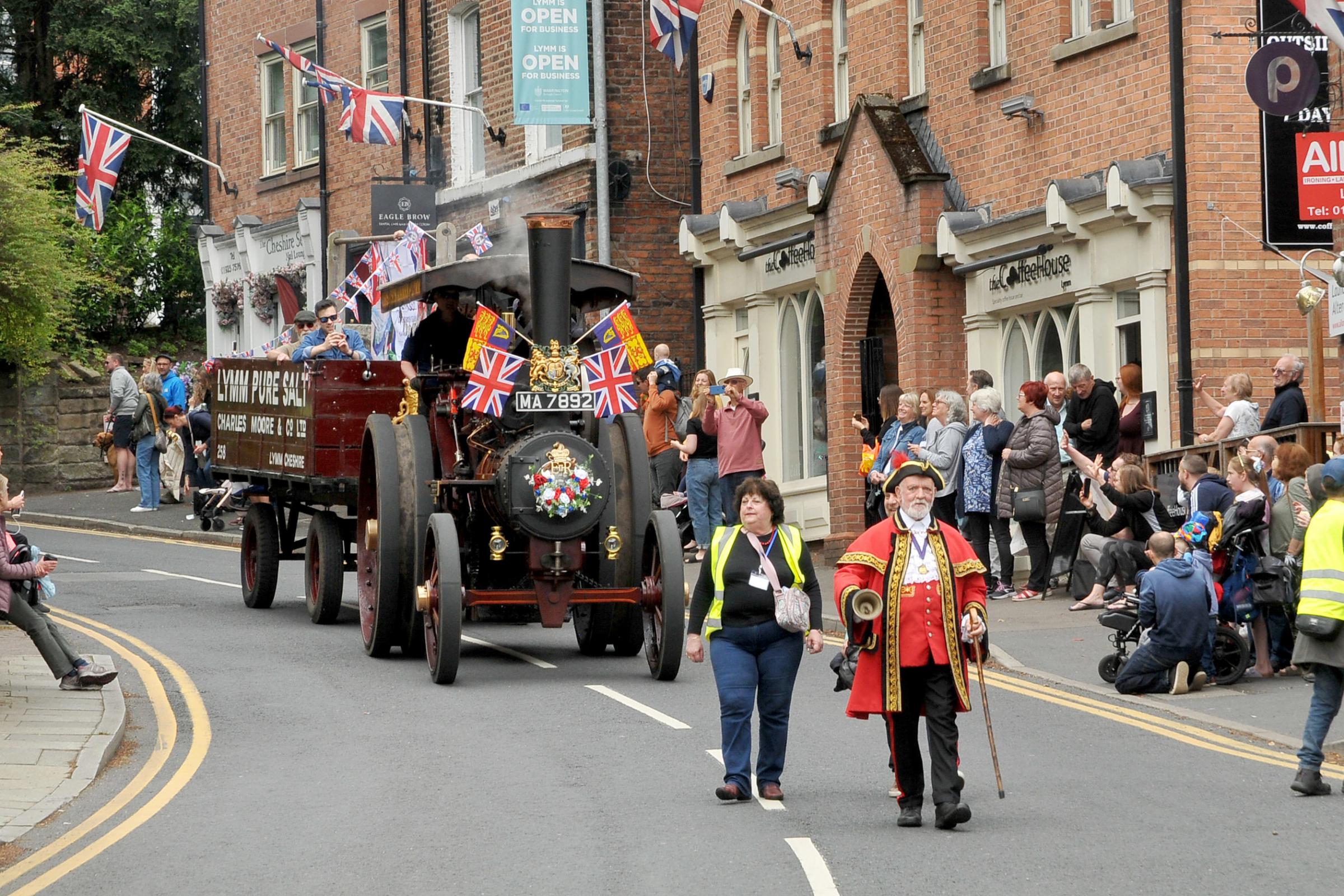 The procession heading through the village