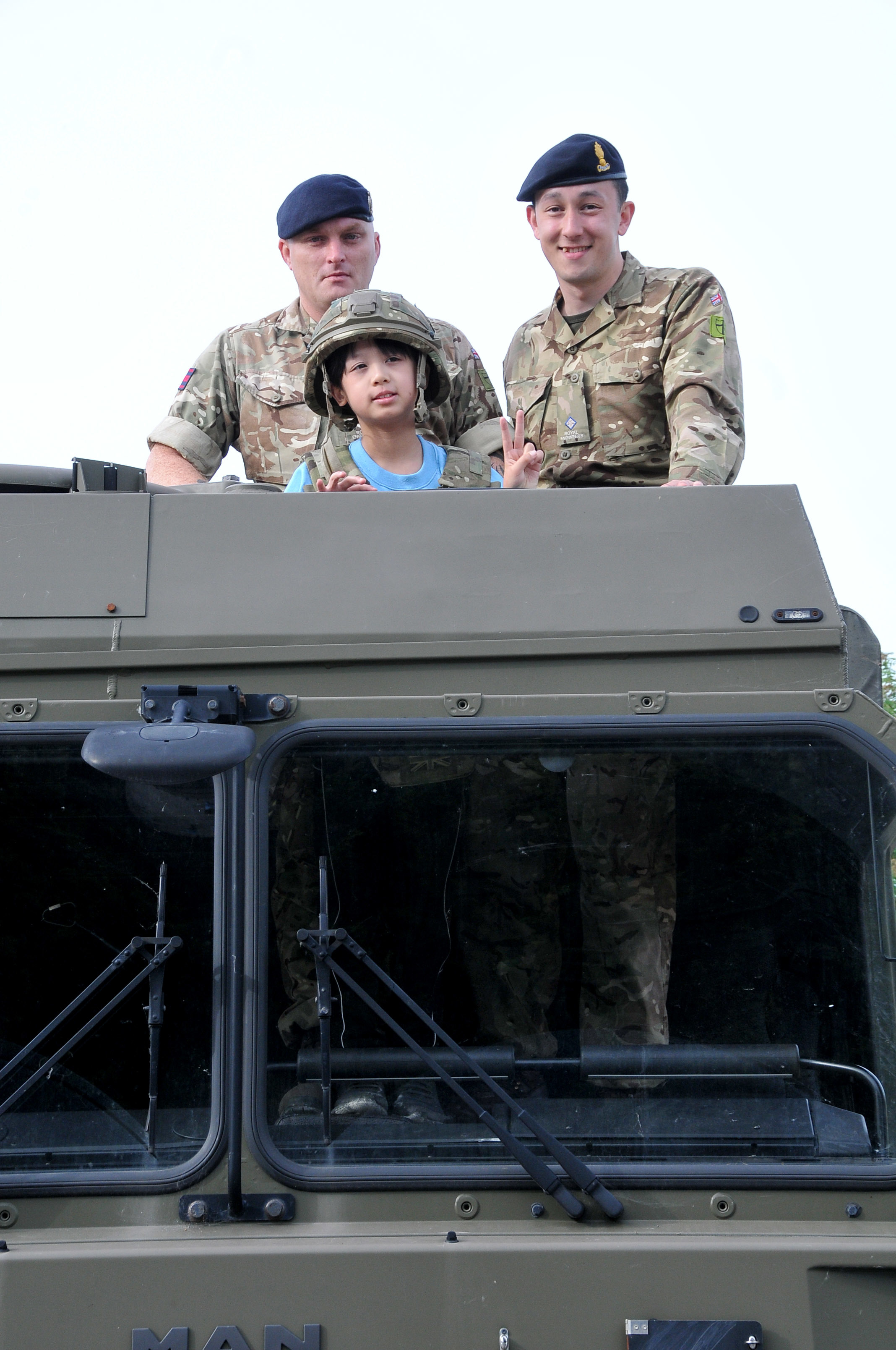 Davy Tam with corporal Ryan Turner and second lieutenant Adam Kee