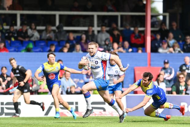 Warrington Guardian: One of two tries scored by Wakefield's James Batchelor, usually a back rower but playing in the centre. Picture: SWpix.com
