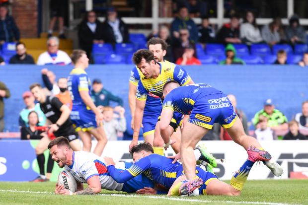 Warrington Guardian: Liam Hood's barge-over try from dummy half for Wakefield Trinity against Warrington Wolves. Picture: SWpix.com