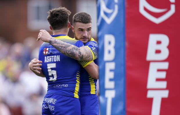 Warrington Guardian: Connor Wrench is first to congratulate Matty Ashton on his interception try. Picture: PA