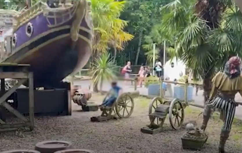 The child pictured sitting on the wooden cannon