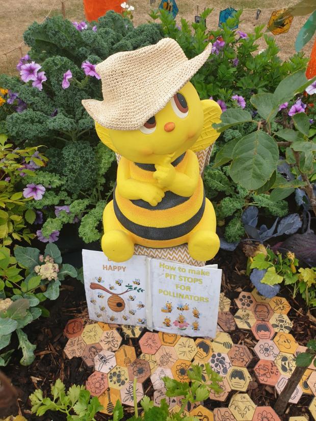 Warrington Guardian: Children were thrilled to see so many bees and butterflies on their allotment Picture: Michelle Culliford