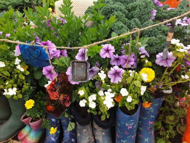 Warrington Guardian: Pupils filled wellies with colourful flowers Picture: Michelle Culliford