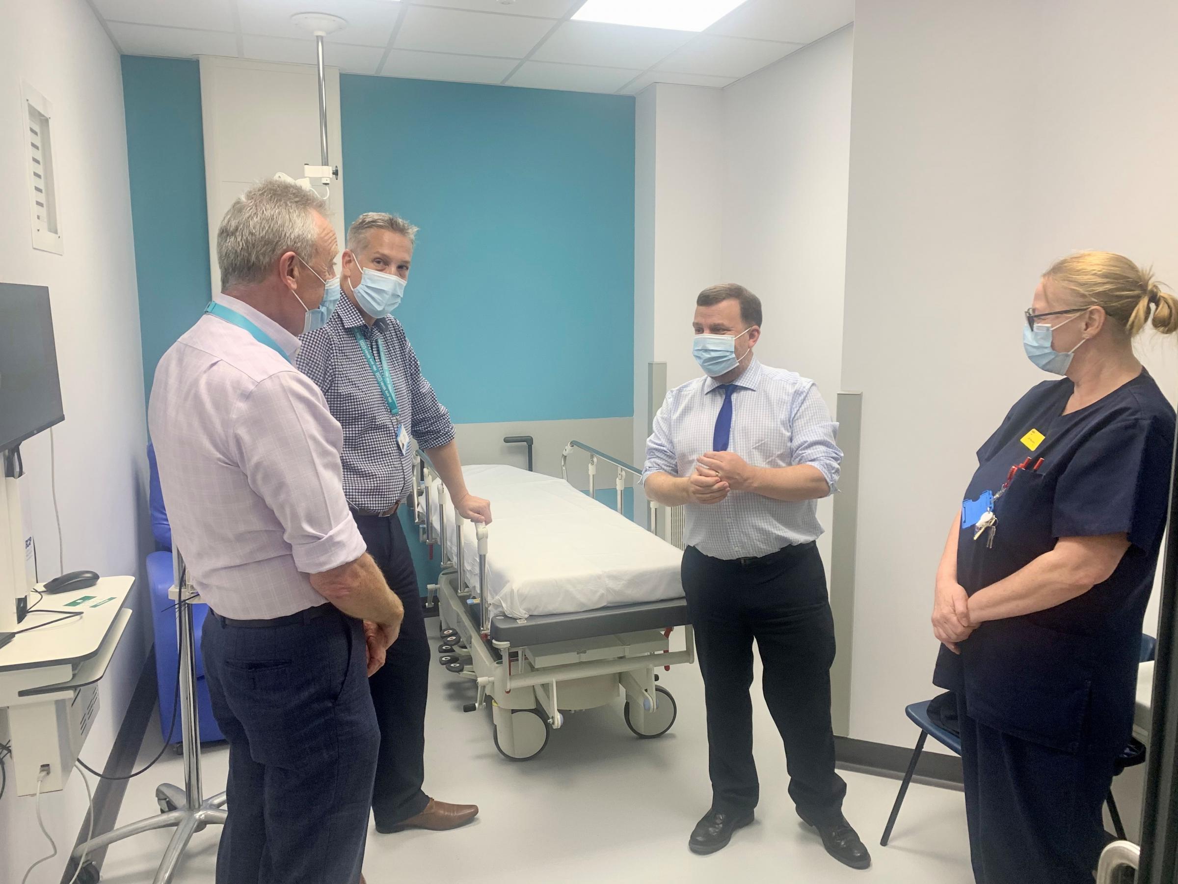 Warrington South MP Andy Carter speaking with staff at Warrington Hospitals new same day emergency care centre