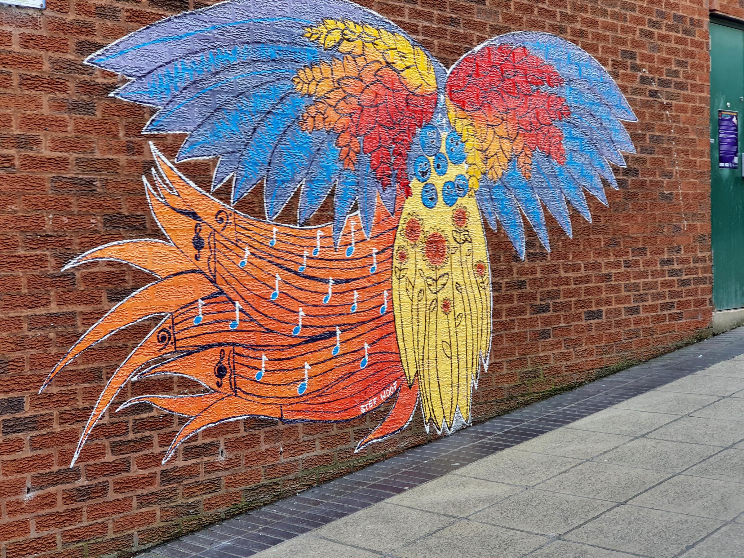 Murals to welcome the Papual New Guinea Rugby League World Cup team have appeared around Warrington