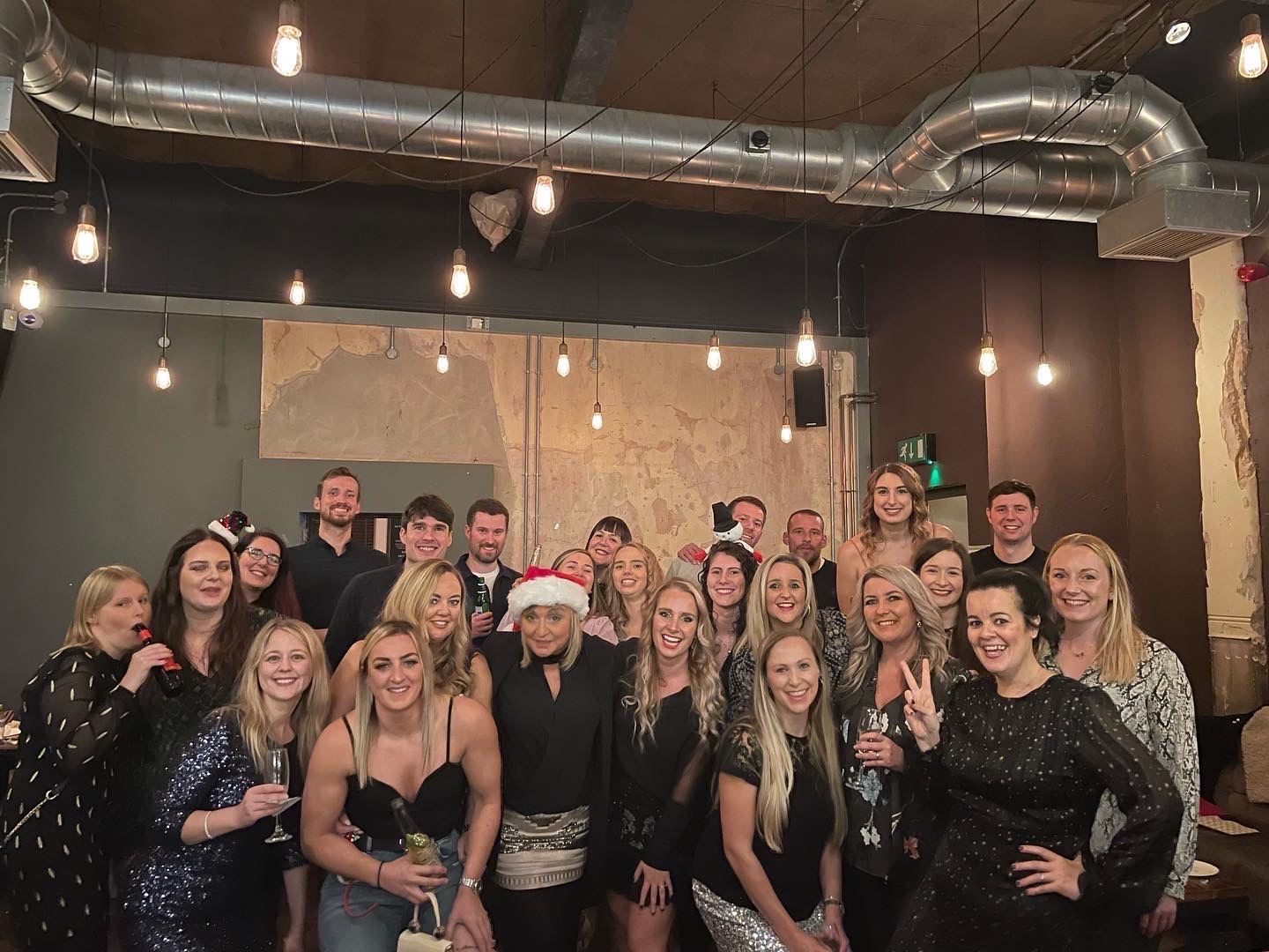 Jemma and her clients enjoying a Christmas party together