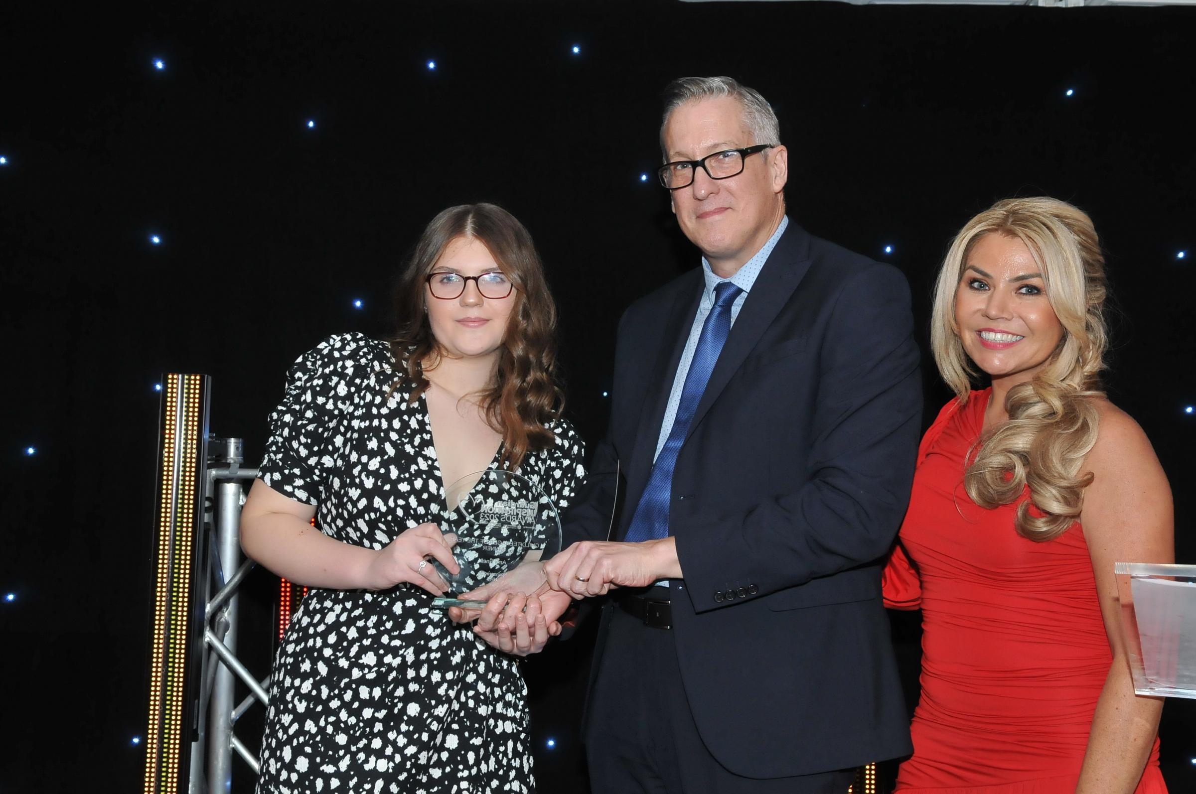 2023 Teenager of the Year Award winner Amy Snell with Warrington and Halton Teaching Hospitals NHS Foundation Trust chief executive, Professor Simon Constable and presenter Leanne Campbell