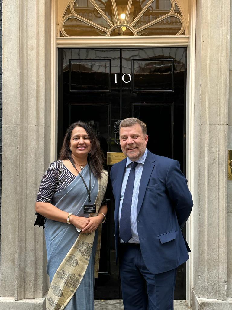 Dr Jain outside Downing Street with Andy Carter