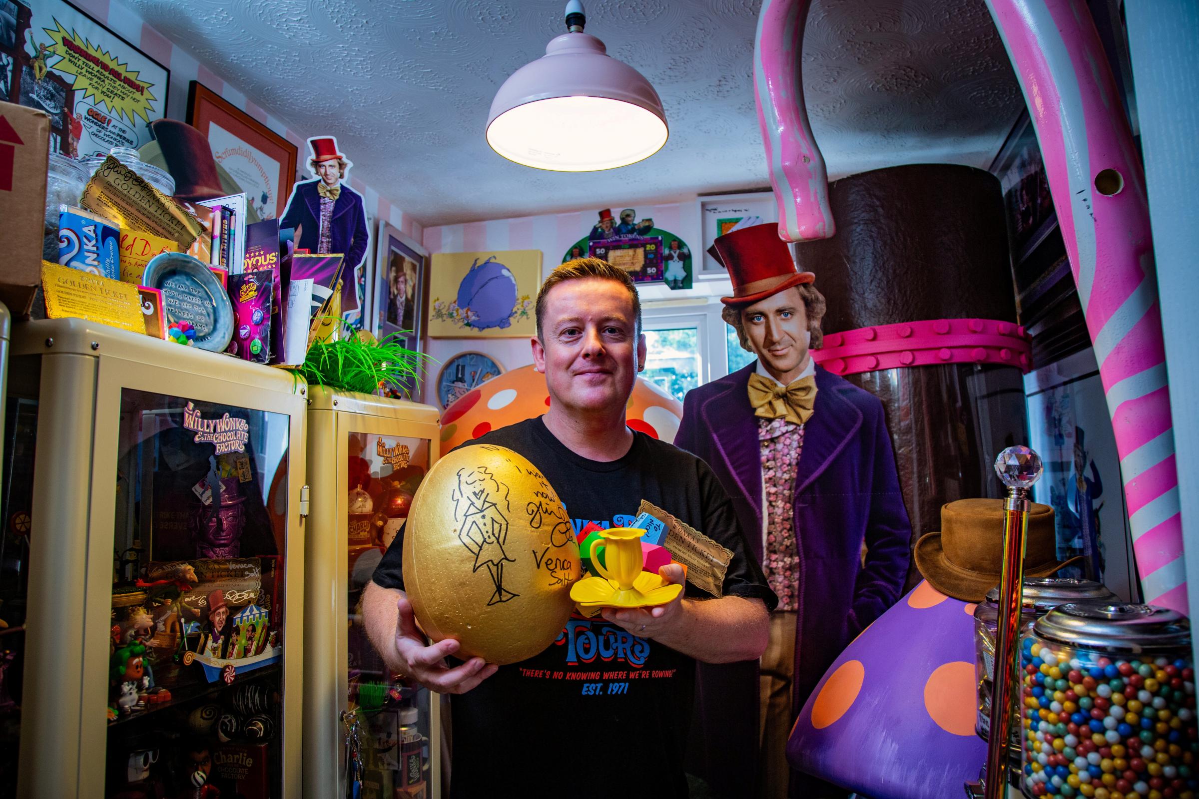 Nick Anderton with his Willy Wonka collection. Picture: SWNS