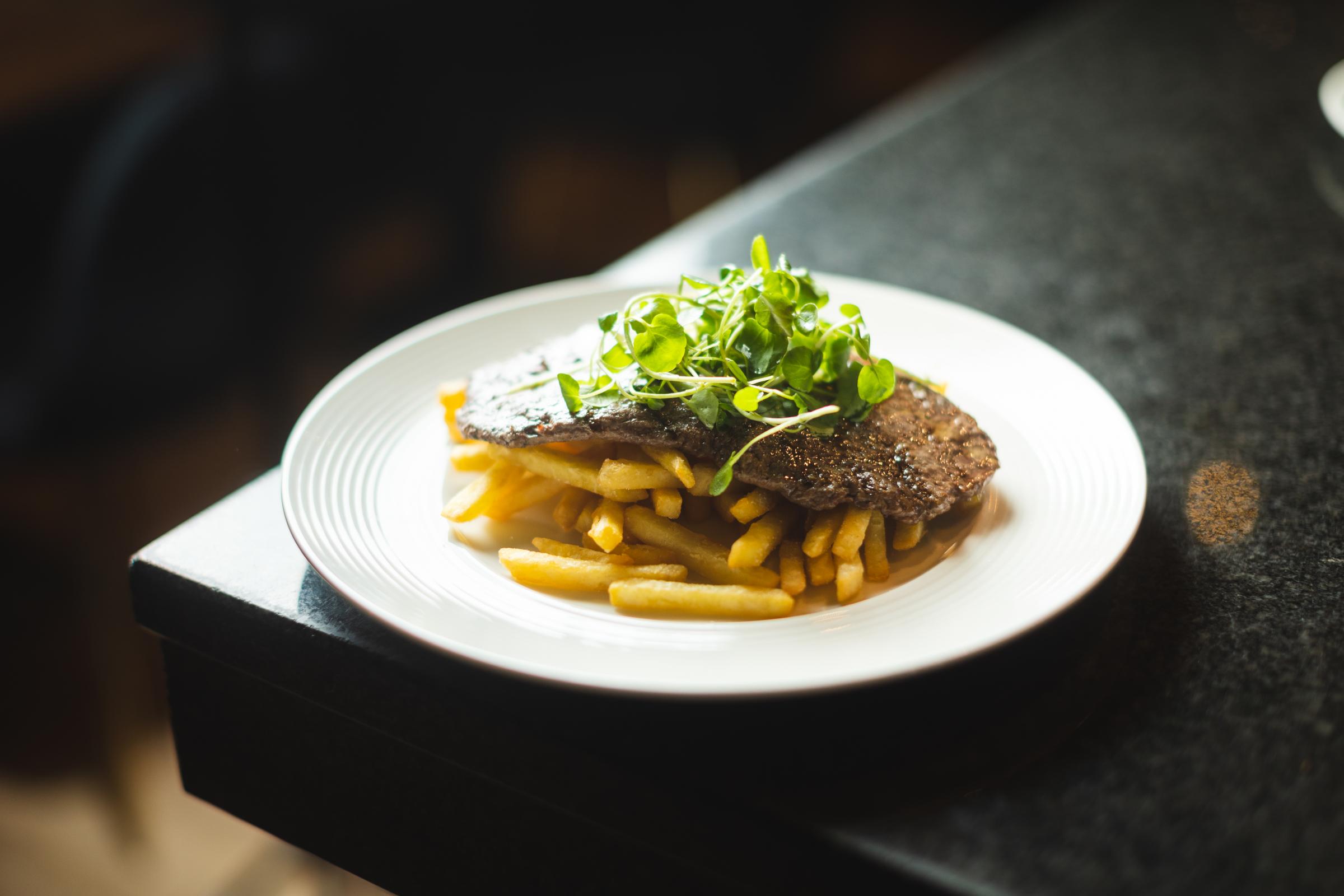 Steak frites - flattened 6oz rum steak with French fries and garlic butter