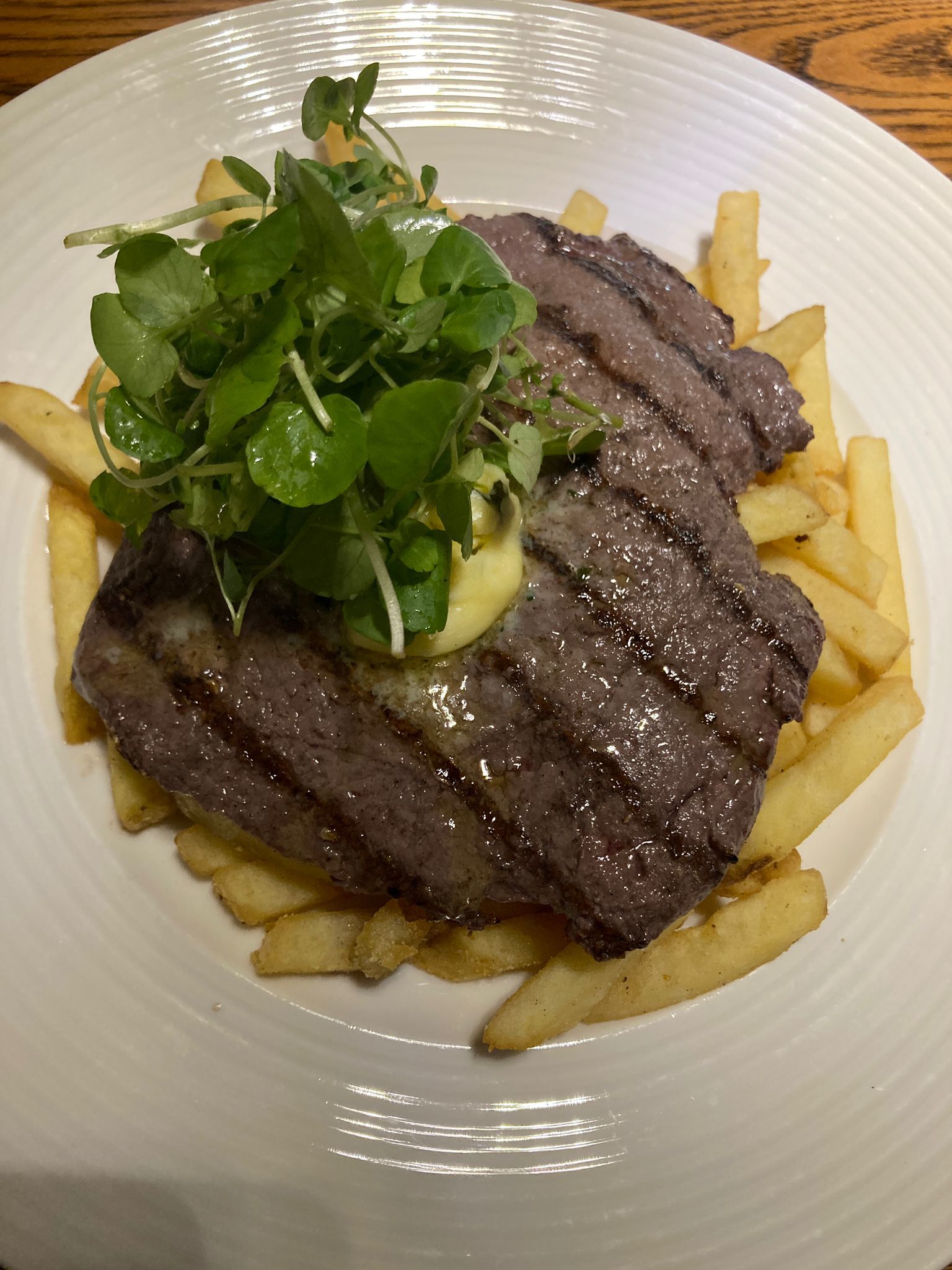 Steak frites - flattened 6oz rump steak with French fries and garlic butter