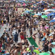Crowds gather on the beaches in Bournemouth. Picture by PA.