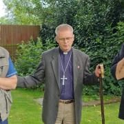 The Bishop of Chester praying a blessing over the walkers