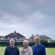 Winning pair Audrey Brown and Norman Deakin are presented with the trophy by competition sponsor Tony Smith