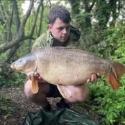 James Lavelle with his 22lb mirror carp caught at Rixton Claypits