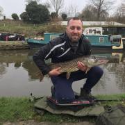 Warrington Anglers' Association member David Tasker with the pike he caught on the Bridgewater Canal