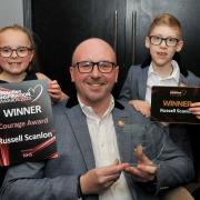 Courage Award winner in 2023 Russell Scanlon with children Keeva and Logan